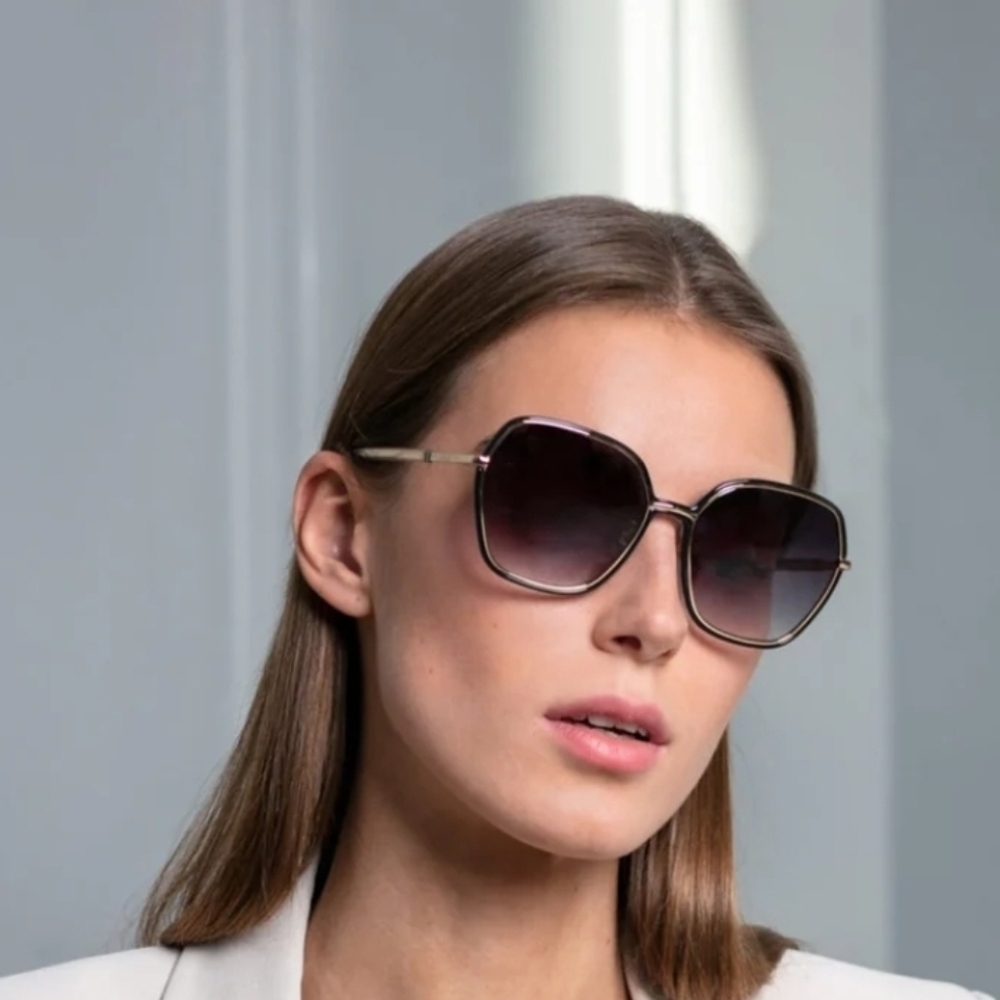 NWT Furla Furla SFU539 sunglasses with a gold metal frame and gradient lenses.